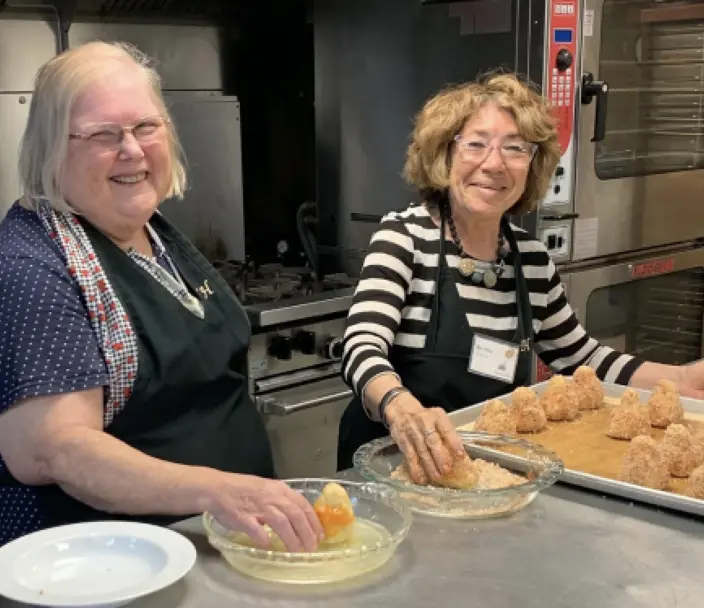 Volunteers help in the kitchen at Terrace Hill
